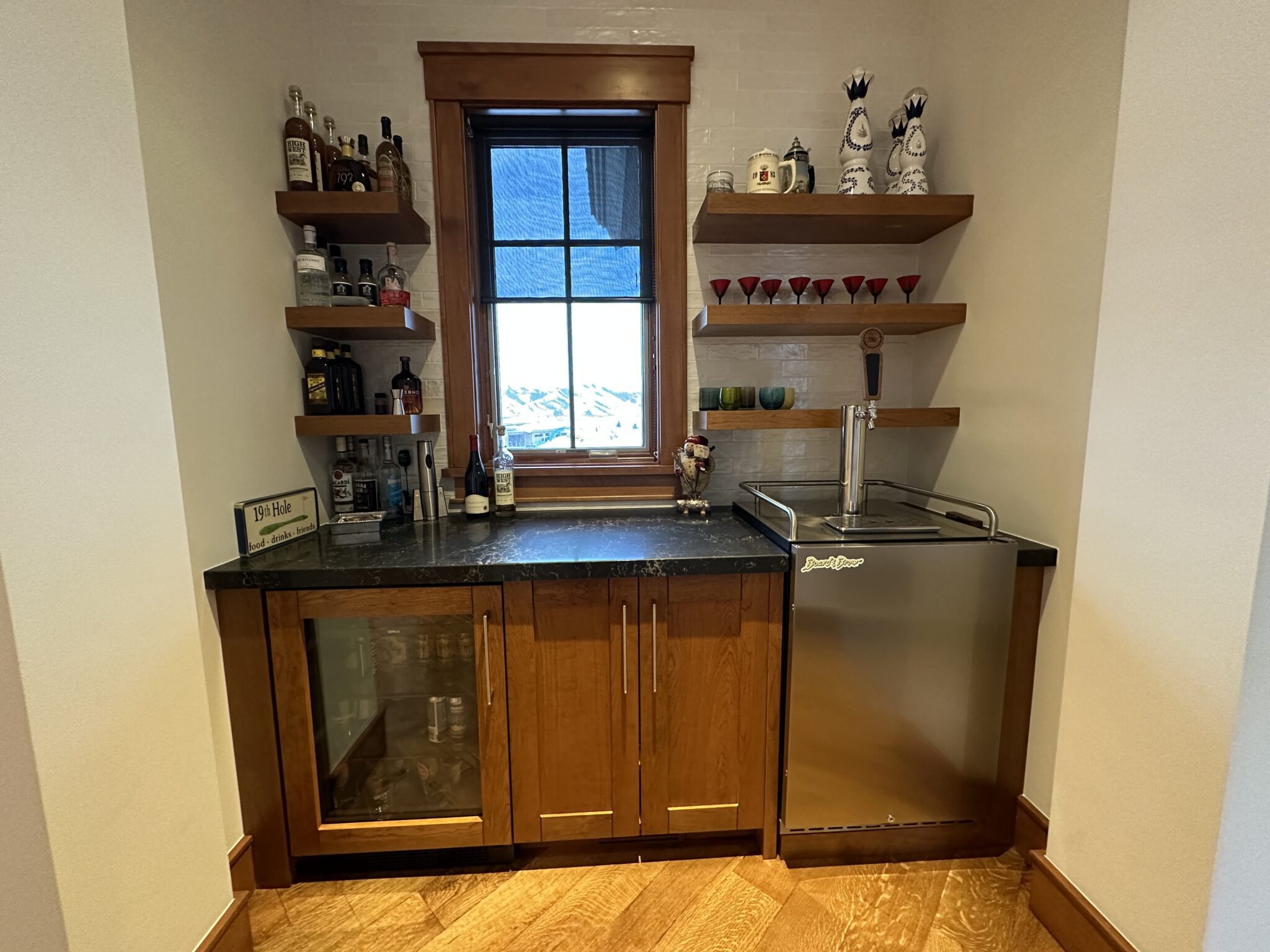 A Bar With a Refrigerator and Shelves