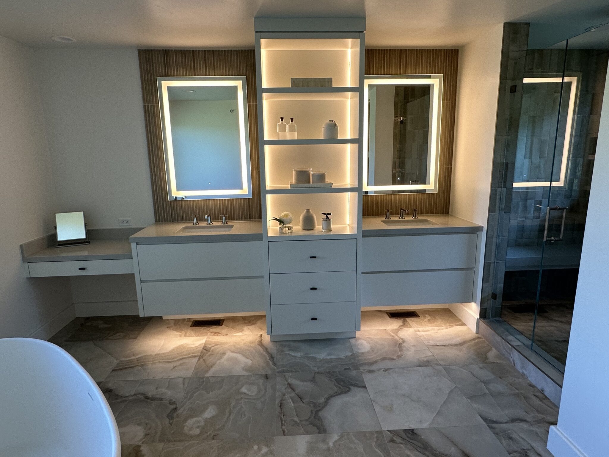A Bathroom With a Large Mirror and a Jacuzzi