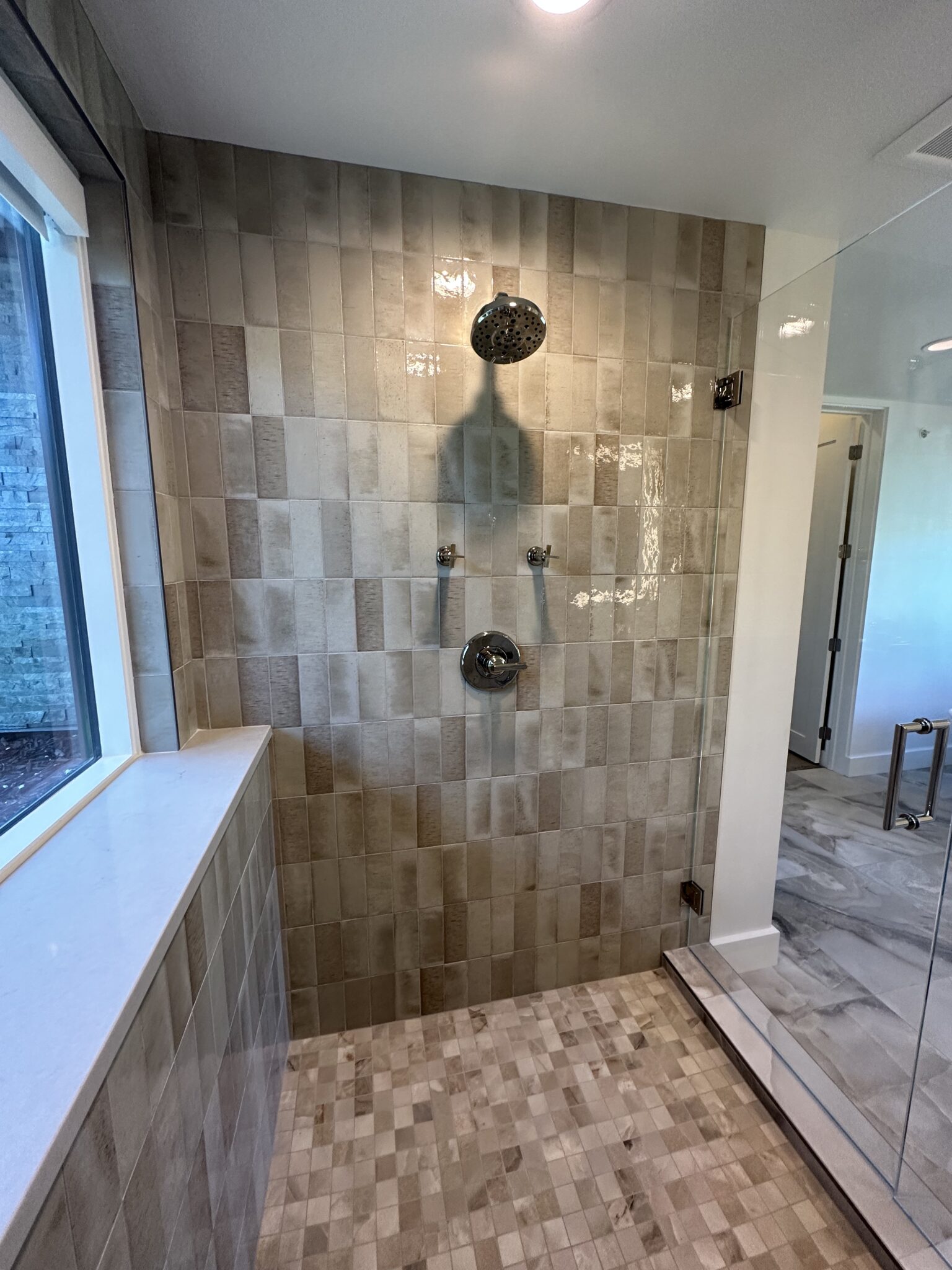A Shower With a Large Glass Door