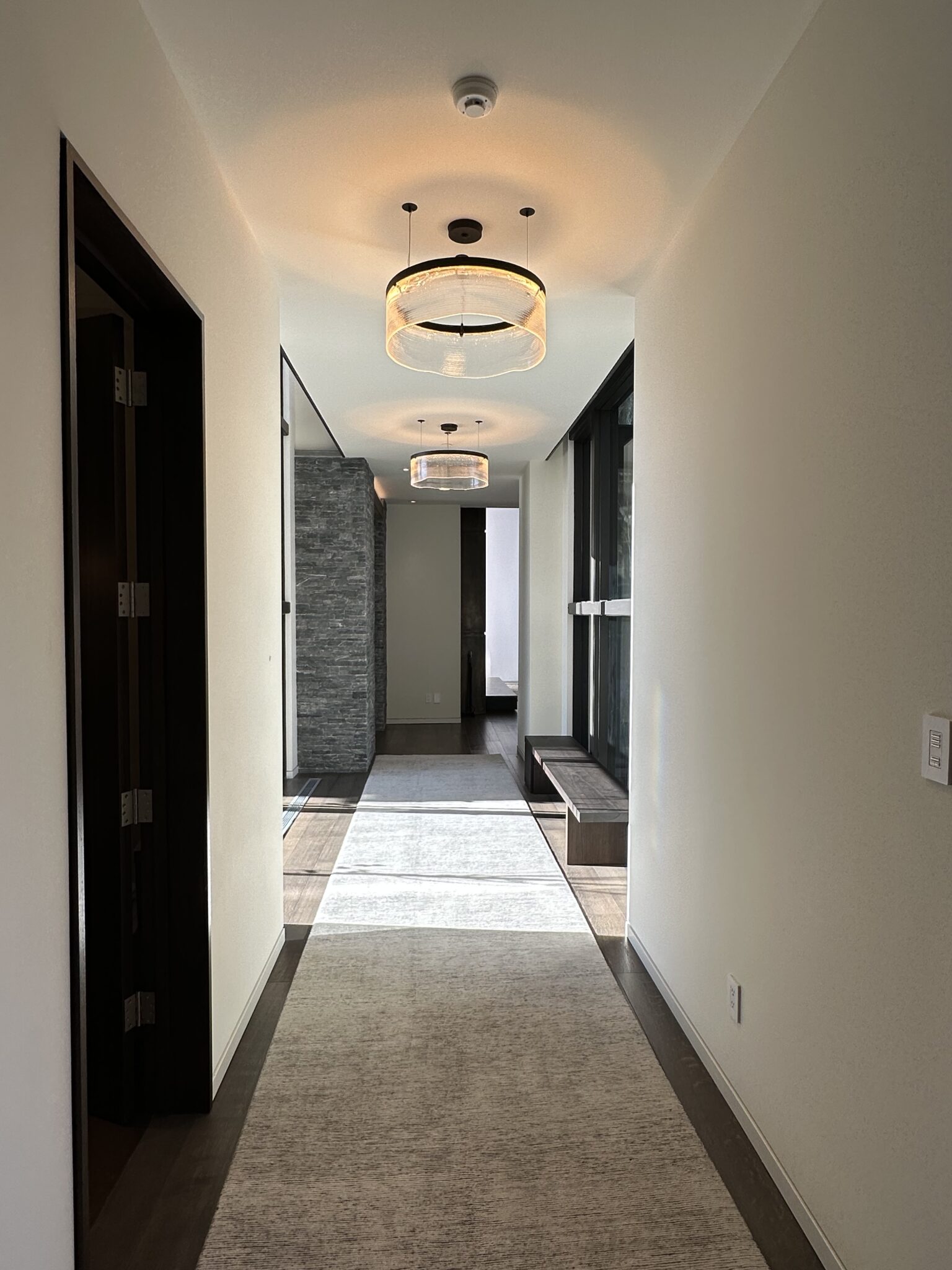 A Hallway With Lights and a Mirror