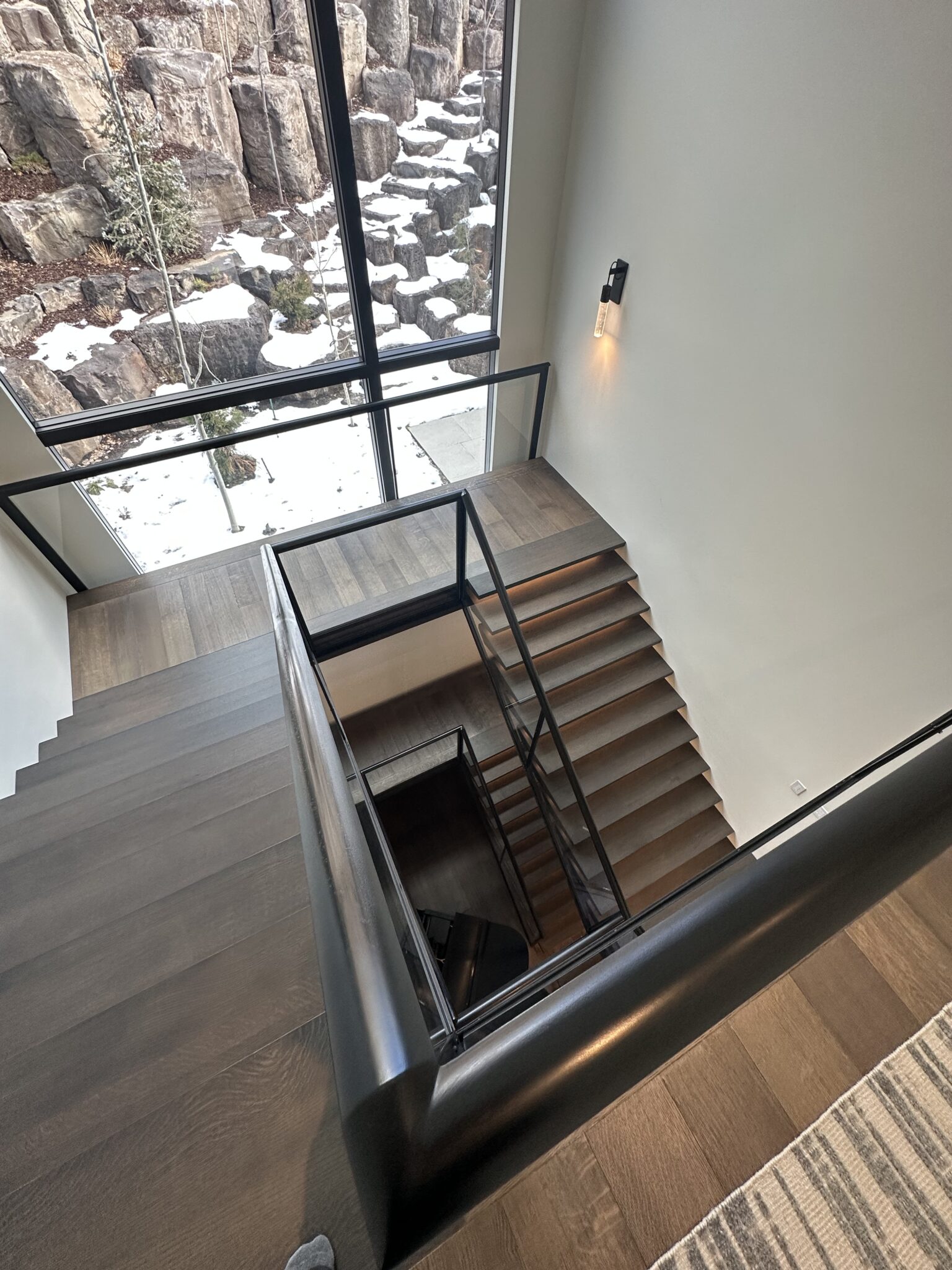 A Staircase With a Glass Railing