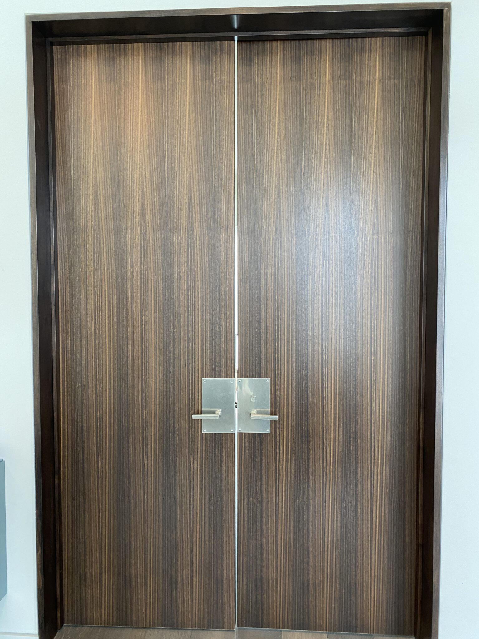 A Double Door With Metal Handles