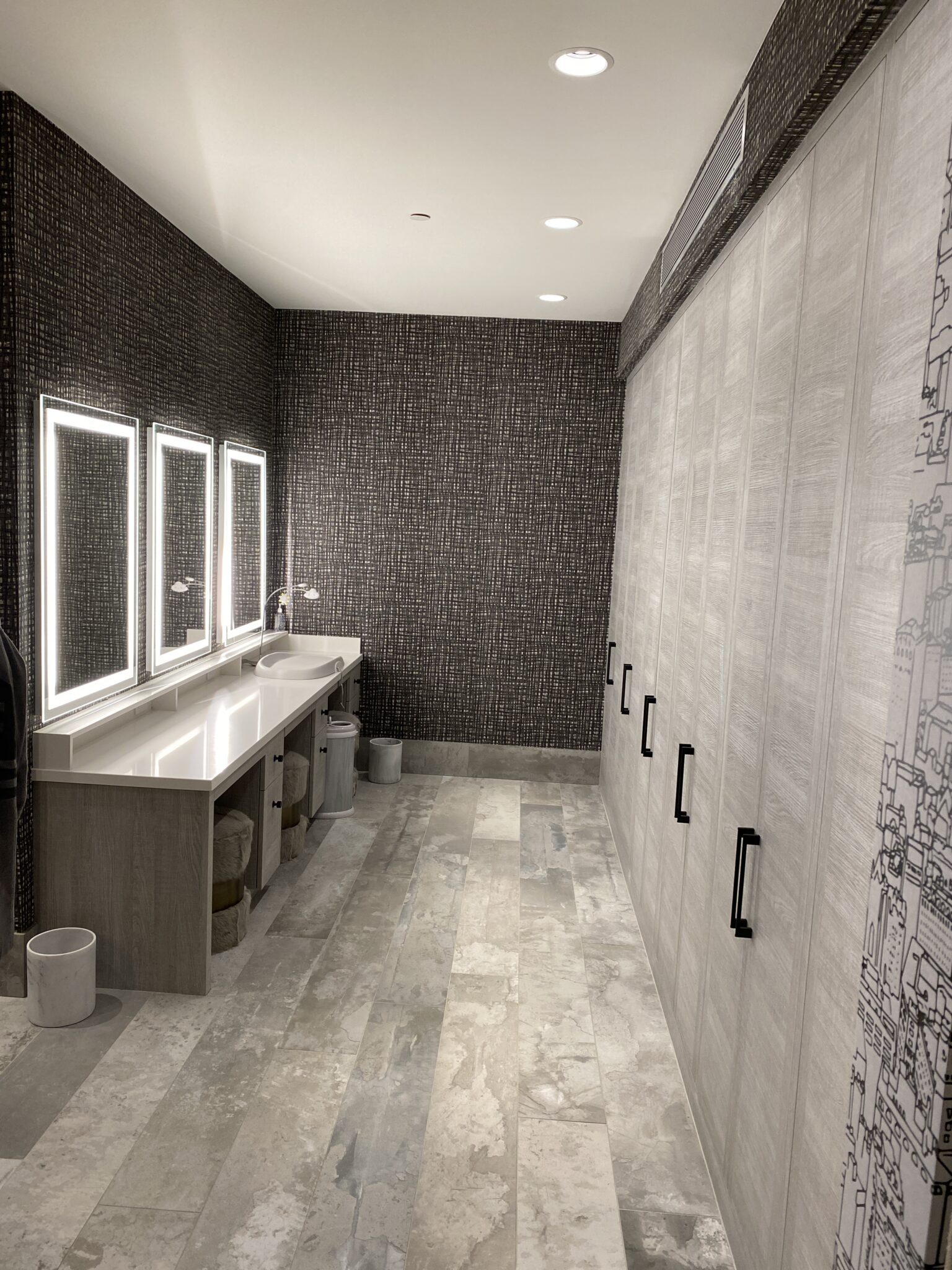 A Bathroom With Mirrors and Sinks